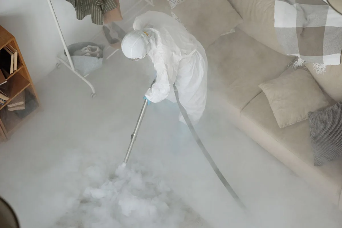 Biohazard cleanup technician in protective equipment, Buchanan, NY